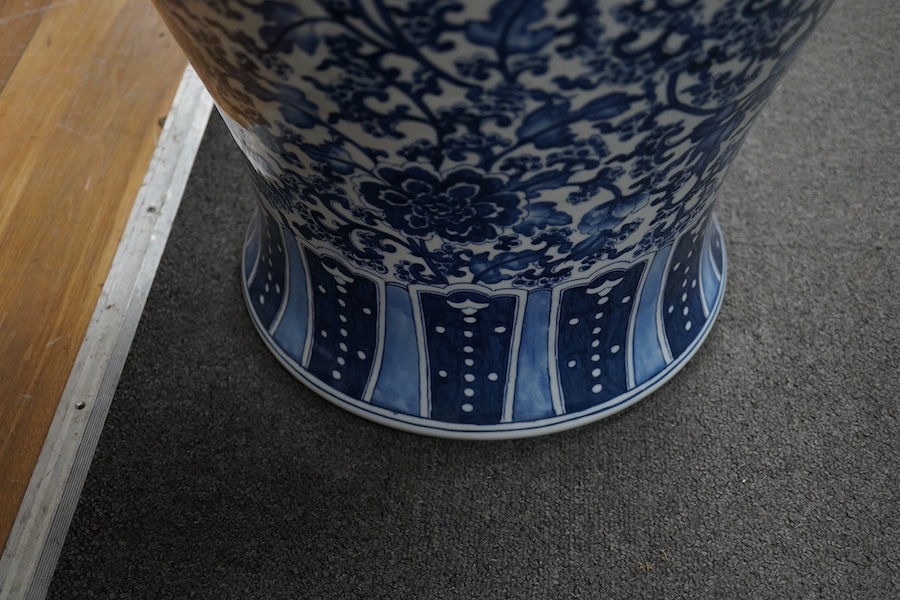 A massive Chinese blue and white floor standing baluster vase, decorated with peonies and foliage, 120cm high. Condition - good